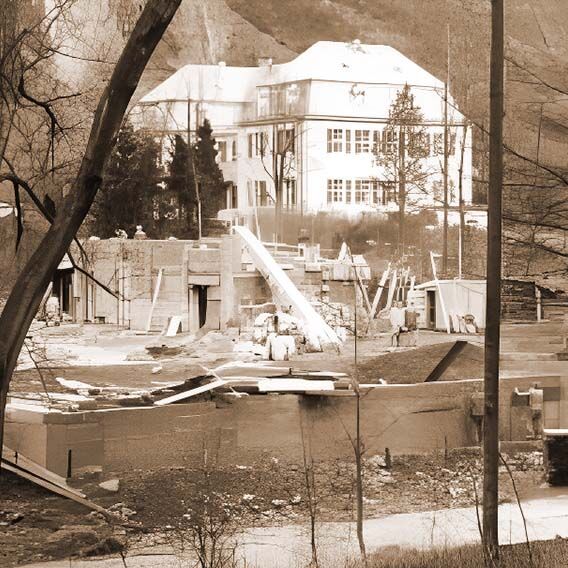 Black and white image of two buildings in exterior view.